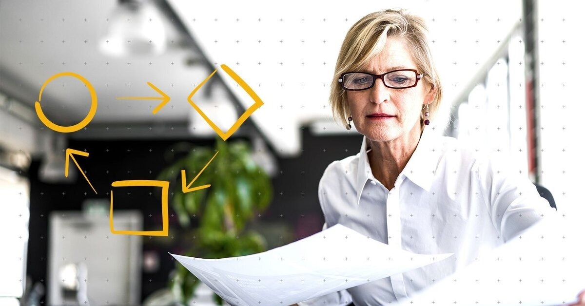 a woman looking at papers