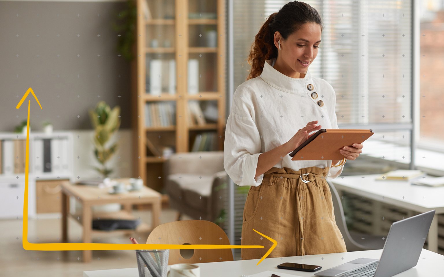 Woman looking at her ipad while listing to music