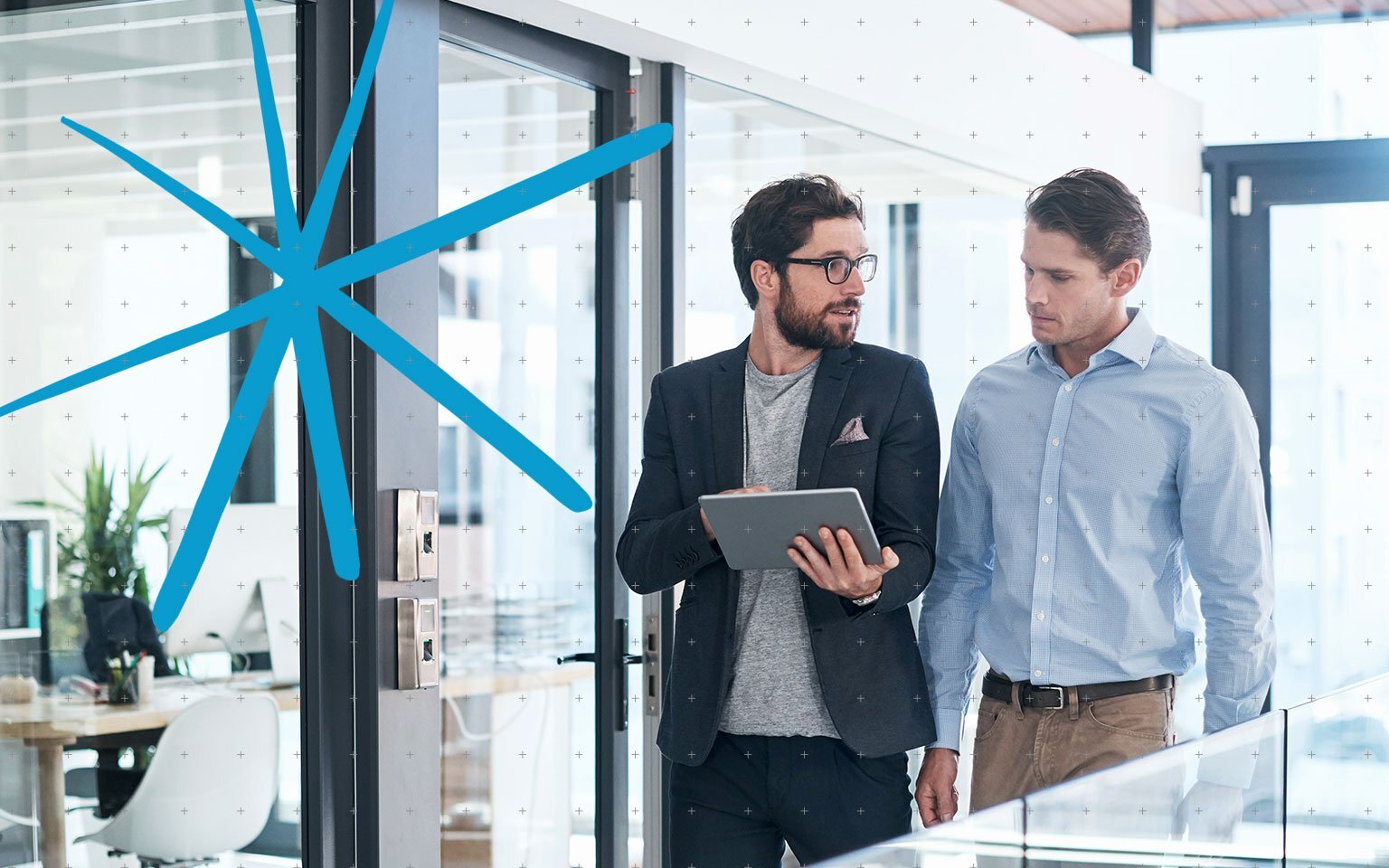 Two business professionals walking in a modern office